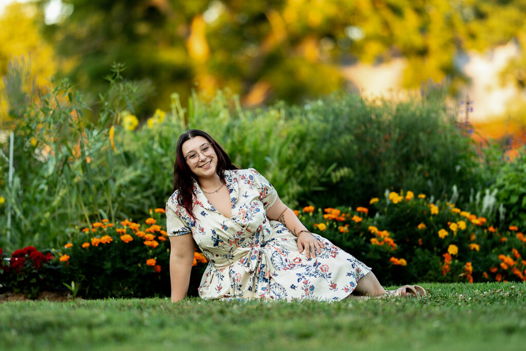 Professional portrait session surrounded by colorful summer flowers in York, PA. John Rudy Park portraits